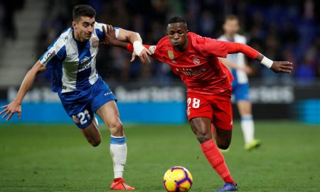 Marc Roca battles for the ball