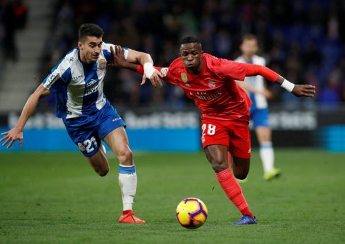 Marc Roca battles for the ball