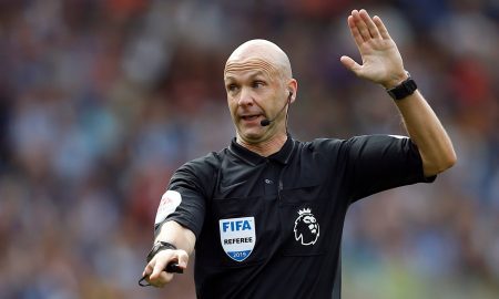 Referee Anthony Taylor gestures v Brighton after disallowing a Leandro Trossard goal after a VAR review, August 2019