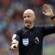 Referee Anthony Taylor gestures v Brighton after disallowing a Leandro Trossard goal after a VAR review, August 2019