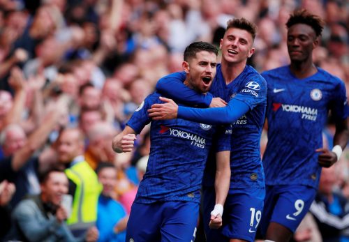 Chelsea's Jorginho celebrates scoring their first goal v Brighton & Hove Albion with teammate Mason Mount
