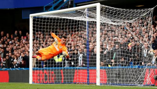 Chelsea's Marcos Alonso scores their third goal as Newcastle United's Karl Darlow attempts save
