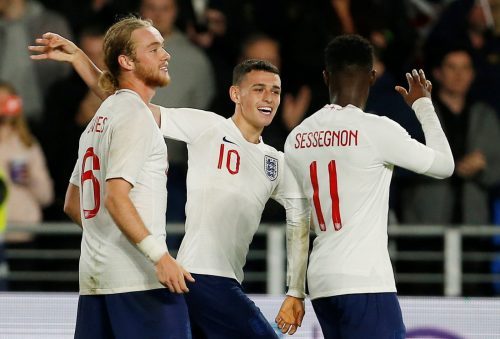 England U21's Phil Foden, Ryan Sessegnon and Tom Davies celebrate at the end of the match