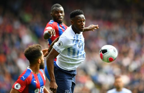 Everton's Yerry Mina in action with Crystal Palace's Christian Benteke and Andros Townsend
