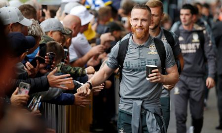 Leeds United's Adam Forshaw interacts with fans after arriving at Elland Road before the Swansea match, Aug 2019