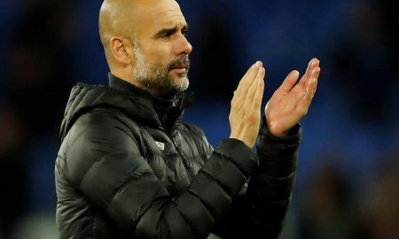 Manchester City manager Pep Guardiola applauds fans after the Everton match