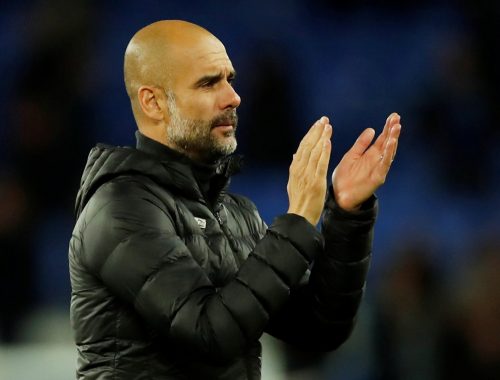 Manchester City manager Pep Guardiola applauds fans after the Everton match