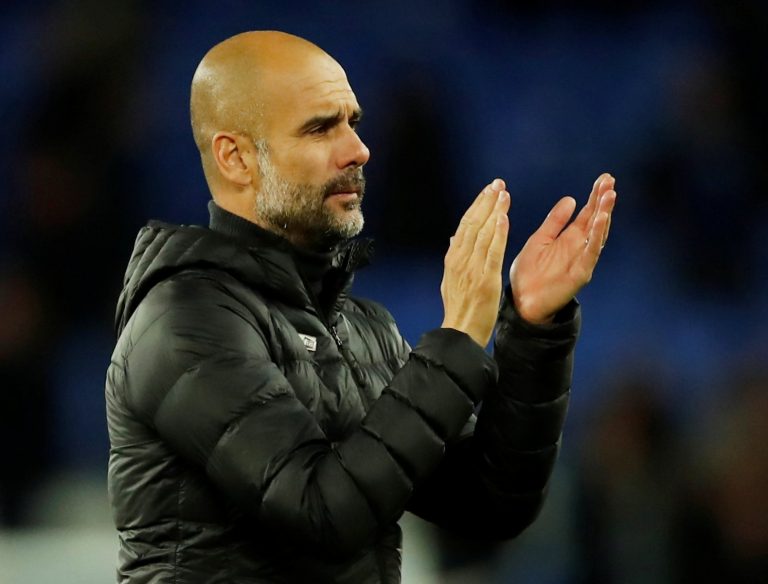 Manchester City manager Pep Guardiola applauds fans after the Everton match