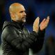 Manchester City manager Pep Guardiola applauds fans after the Everton match