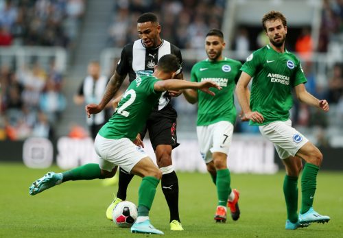 Newcastle United's Jamaal Lascelles in action with Brighton and Hove Albion's Martin Montoya
