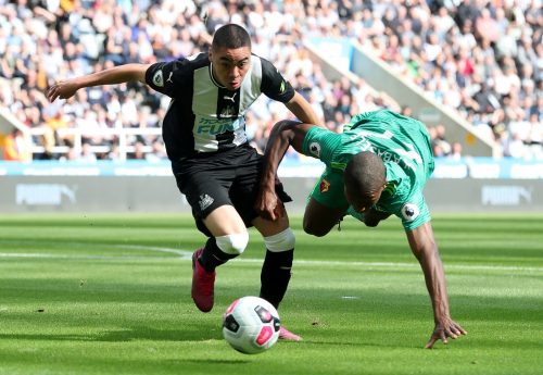 Newcastle United's Miguel Almiron in action with Watford's Christian Kabasele