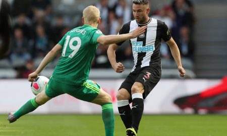 Newcastle United's Paul Dummett in action with Watford's Will Hughes