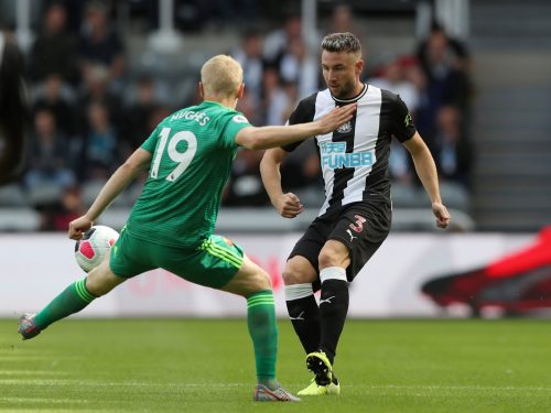 Newcastle United's Paul Dummett in action with Watford's Will Hughes