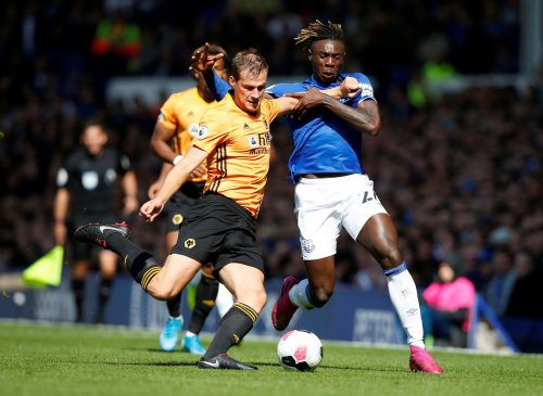 Wolverhampton Wanderers' Ryan Bennett in action with Everton's Moise Kean