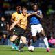 Wolverhampton Wanderers' Ryan Bennett in action with Everton's Moise Kean