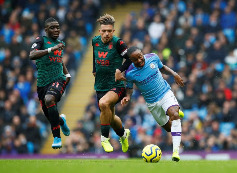 Aston Villa's Jack Grealish and Marvelous Nakamba in action with Manchester City's Raheem Sterling