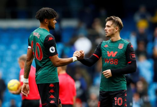 Aston Villa's Jack Grealish shakes hands with Tyrone Mings after the Manchester City match