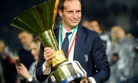 Juventus coach Massimiliano Allegri as he celebrates winning Serie A with the trophy