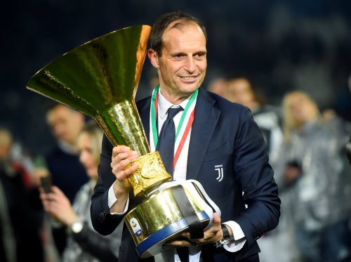 Juventus coach Massimiliano Allegri as he celebrates winning Serie A with the trophy
