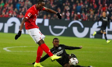 Mainz's Jean-Philippe Mateta shoots at goal as Eintracht Frankfurt's Evan N'Dicka challenges