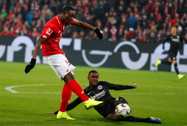 Mainz's Jean-Philippe Mateta shoots at goal as Eintracht Frankfurt's Evan N'Dicka challenges