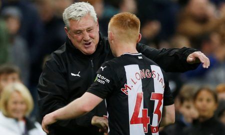 Newcastle United manager Steve Bruce celebrates with Matthew Longstaff after the Manchester United match.JPG