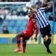 Sheffield Wednesday's Julian Borner in action with Wigan Athletic's Gavin Massey