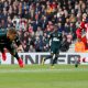 Gayle heads a ball towards goal vs Southampton