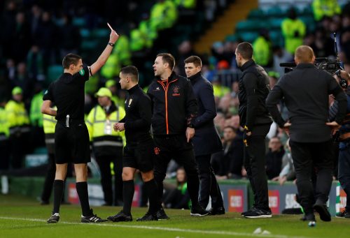 Kevin Clancy shows Michael Beale the red card