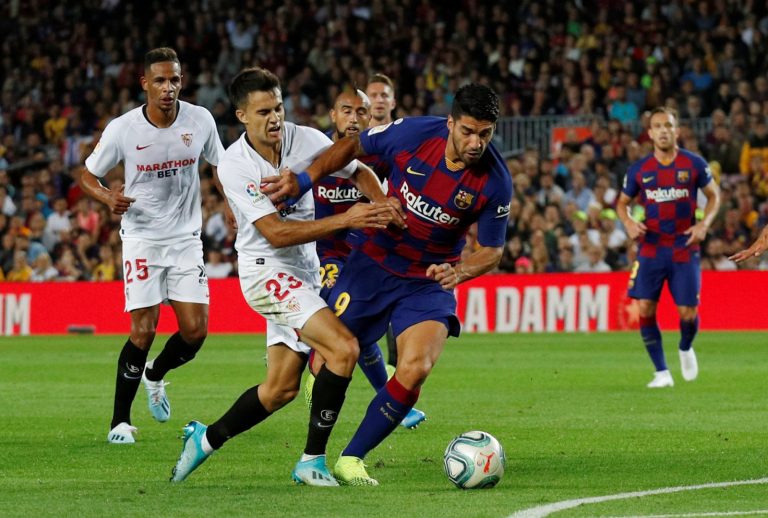 chelsea target sergio reguilon tussles with luis suarez.