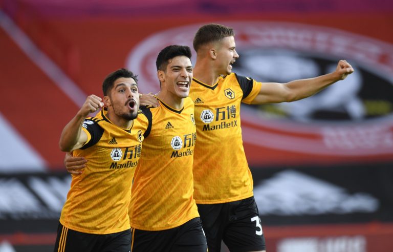 Wolverhampton-Wanderers'-Raul-Jimenez-celebrates-scoring-their-first-goal-with-teammates