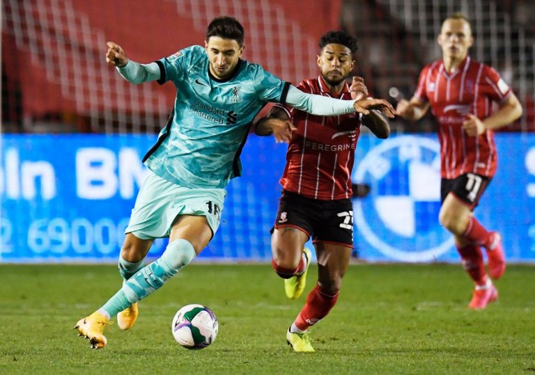 Liverpool's-Marko-Grujic-in-action-with-Lincoln-City's-Liam-Bridcutt