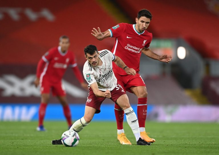 Arsenal's-Granit-Xhaka-in-action-with-Liverpool's-Marko-Grujic