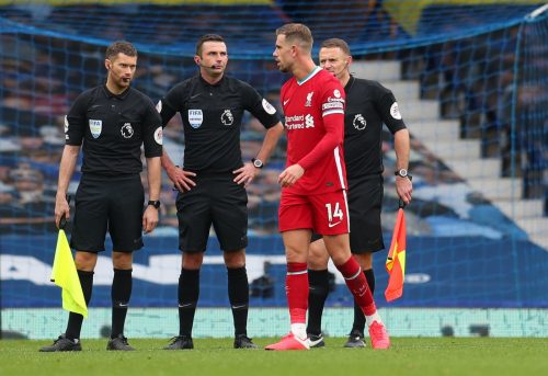 Liverpool's-Jordan-Henderson-speaks-with-referee-Michael-Oliver-and-his-assistants-after-the-match