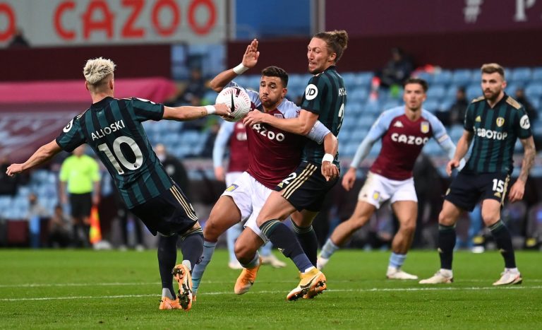 Aston-Villa's-Trezeguet-in-action-with-Leeds-United's-Luke-Ayling