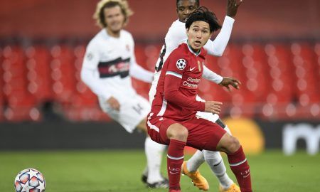 Liverpool's-Takumi-Minamino-in-action-with-FC-Midtjylland's-Frank-Onyeka