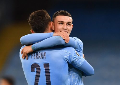 phil foden and ferran torres celebrate in the champions league