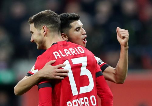 spurs striking target lucas alario celebrates scoring for bayer leverkusen.