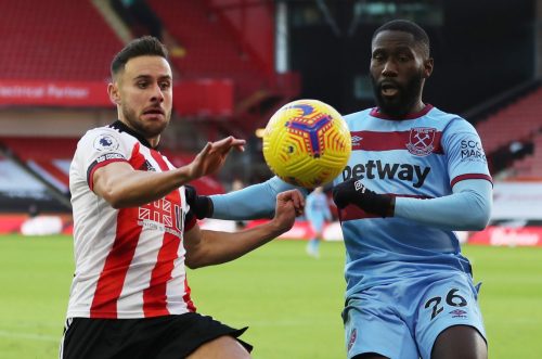 arthur masuaku tussles against sheffield united for west ham