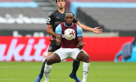 michail antonio tussles for west ham against man city