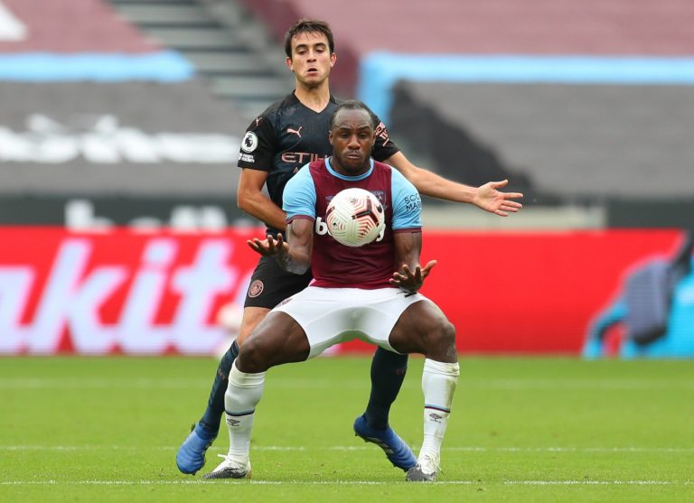 michail antonio tussles for west ham against man city