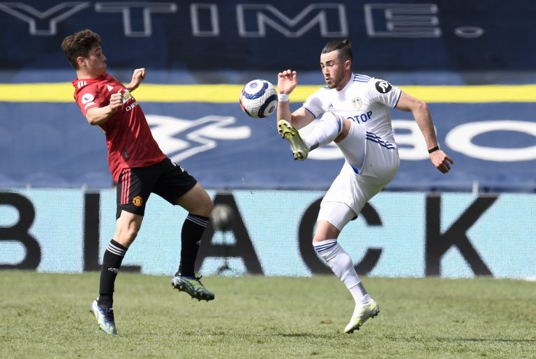 Daniel James and Jack Harrison battle for possession