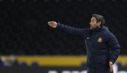 lee-johnson-with-his-arm-outstretched