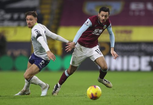 Dwight McNeil of Burnley runs with the ball