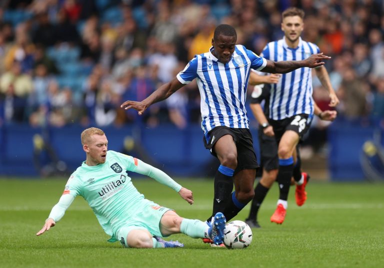 Lewis O'Brien makes a tackle