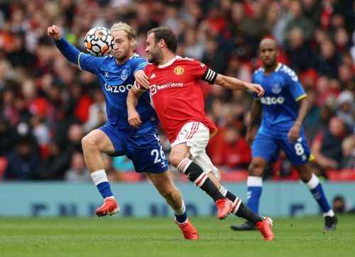 Everton midfielder Tom Davies makes a challenge against Manchester United