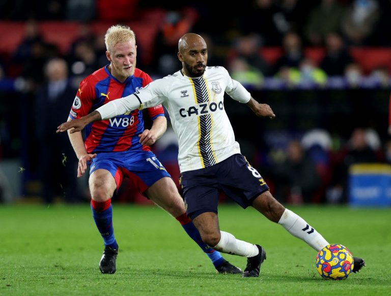 Everton midfielder Fabian Delph holds off Will Hughes
