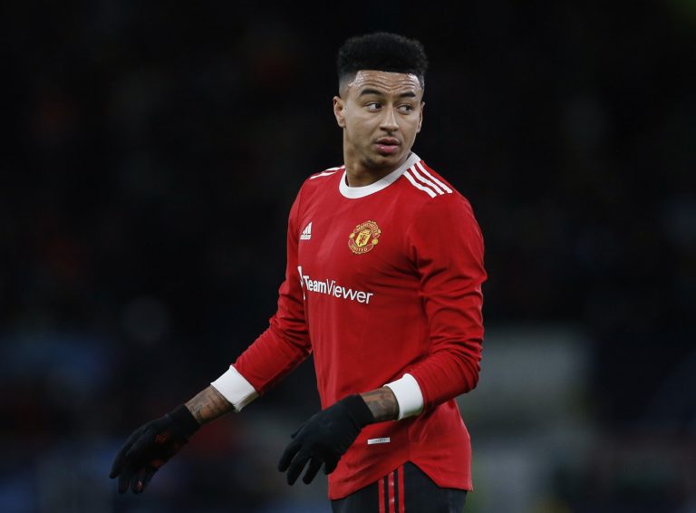 Man United star Jesse Lingard watches on