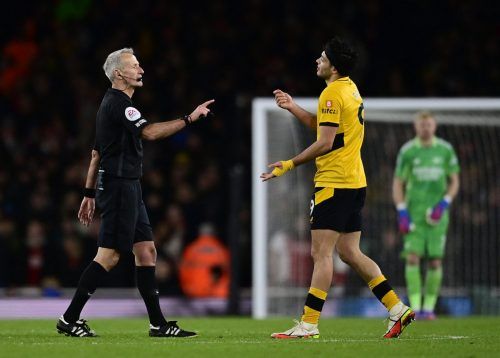 Wolves striker Raul Jimenez speaks to the referee