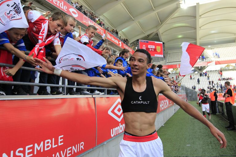 Reims striker Hugo Ekitike celebrates